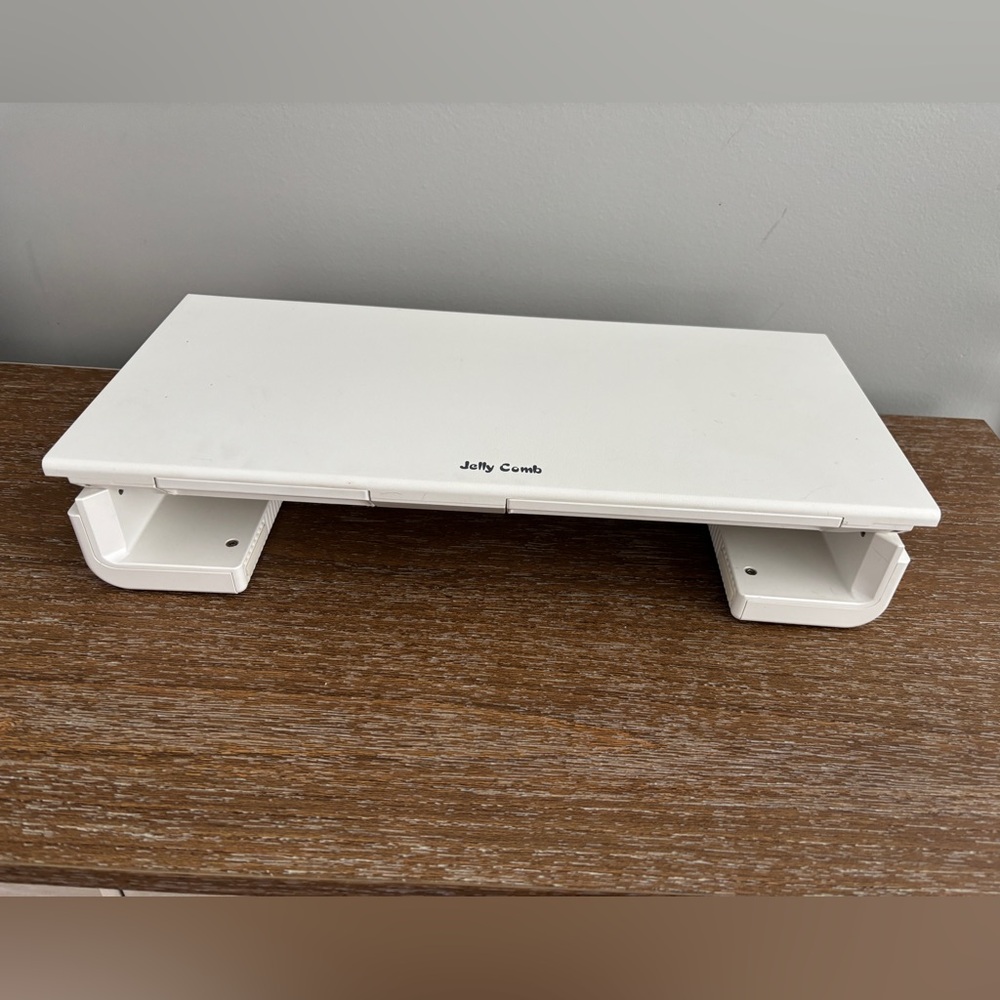 JellyComb Stylish Foldable White Monitor, Adjustable Width 
Has been gently used